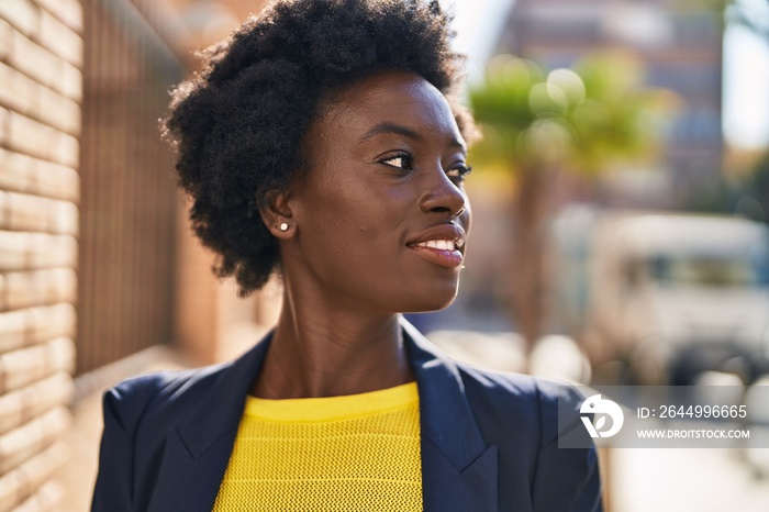 Young african american woman business executive smiling confident at street