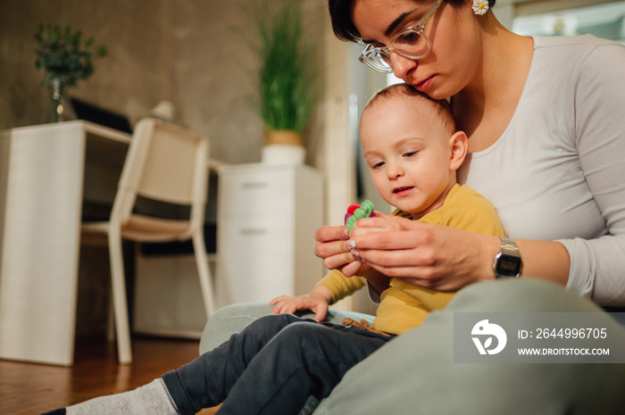 Mother and son molding a clay at home and having educational act