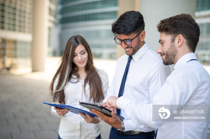 Business people using a tablet outdoor