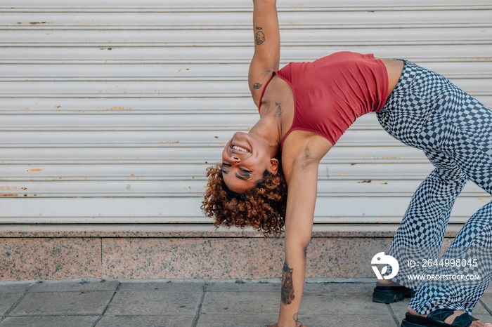 girl practicing modern urban dance in the street