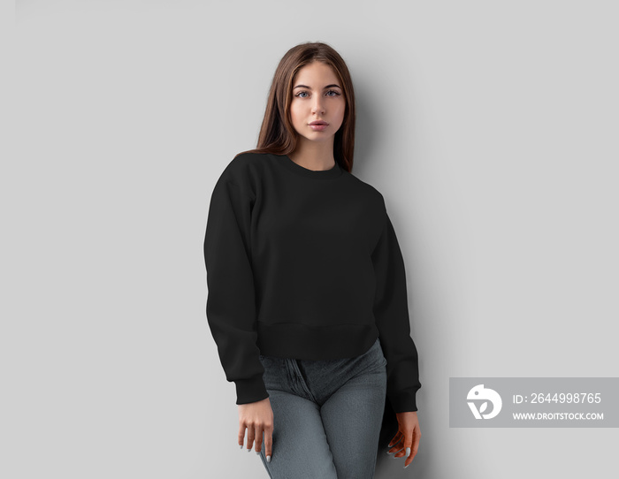 Mockup of black cropped sweatshirt on beautiful girl, fashion shirt isolated on background.