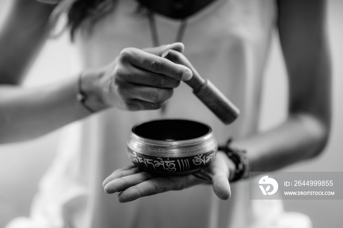 Young woman with Tibetan Singing Bowl