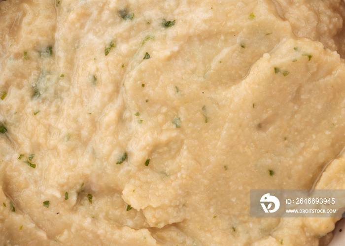 Closeup on hummus sauce texture pattern