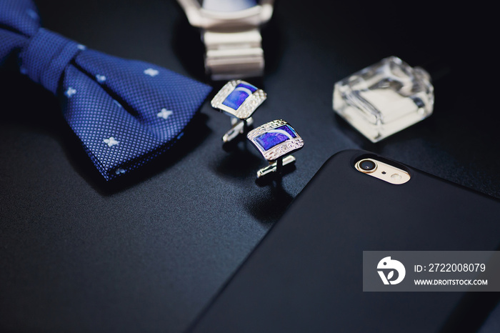 Luxury blue fashion men`s cufflinks. accessories for tuxedo, butterfly, tie and smartphone with scre