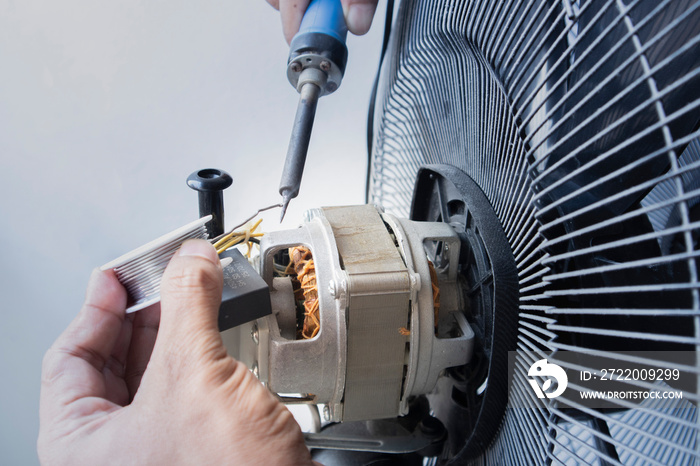 Close-up motor fan Repair and maintenance of home appliances for fixing the fan,  nut and wire coppe