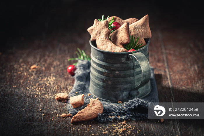 Closeup of gingerbread cookies for Christmas in rustic mug