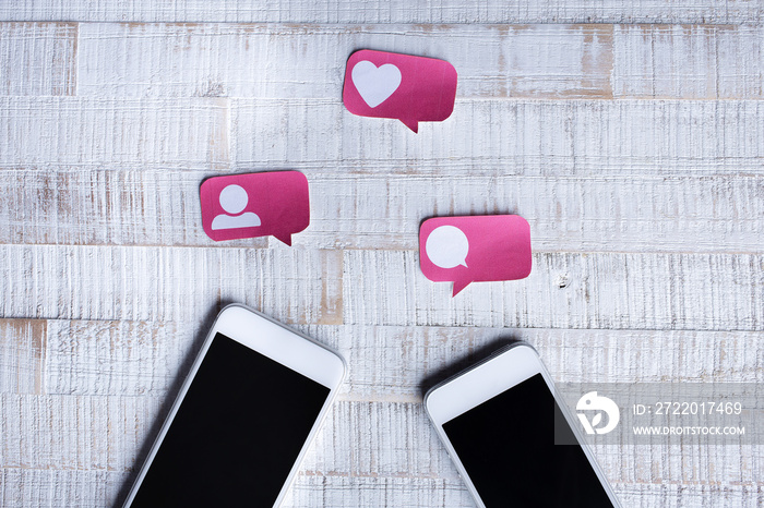Paper Cut Social Media Icons with two Smartphones Content