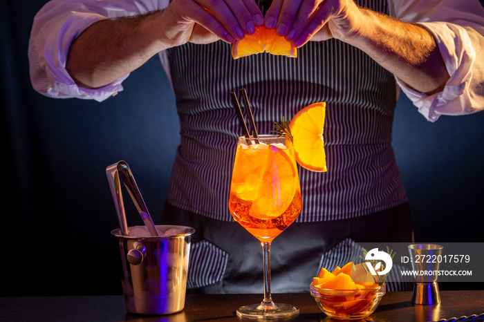 Bartender making Aperol spritz cocktail