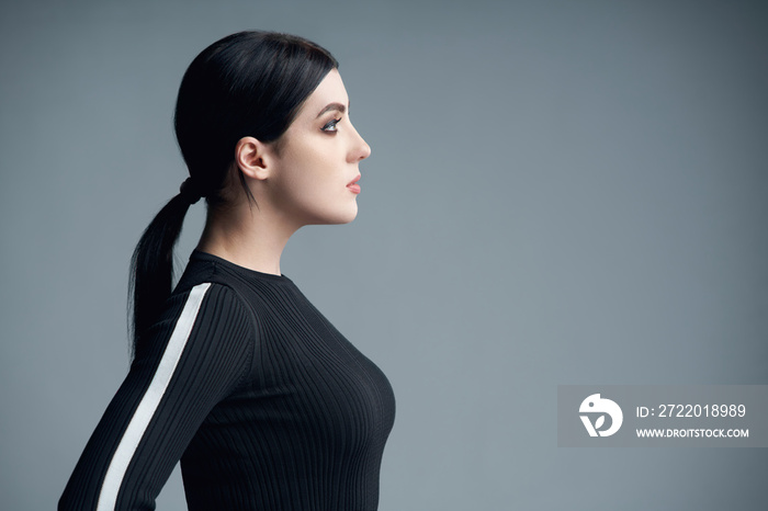 Closeup profile portrait of confident woman looking forward