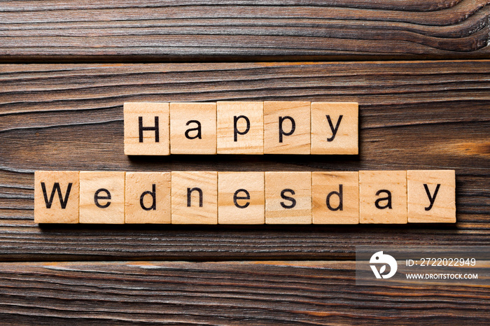 Happy wednesday word written on wood block. Happy wednesday text on wooden table for your desing, co