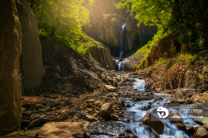 Waterfall in the mountains in summer