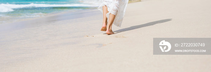 Womans legs on the beach