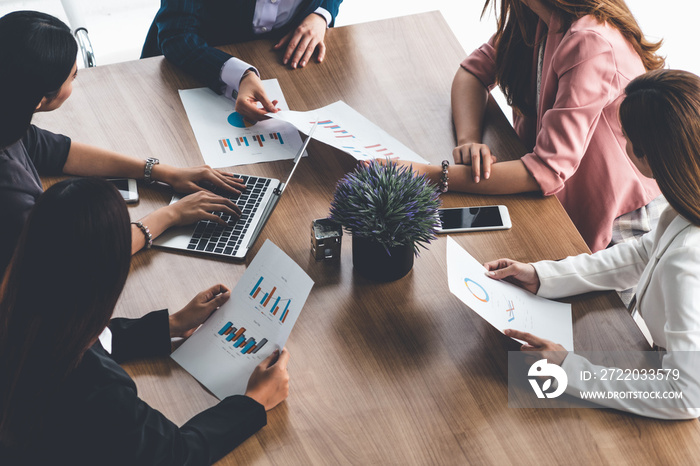 Businesswoman in group meeting discussion with other businesswomen colleagues in modern workplace of