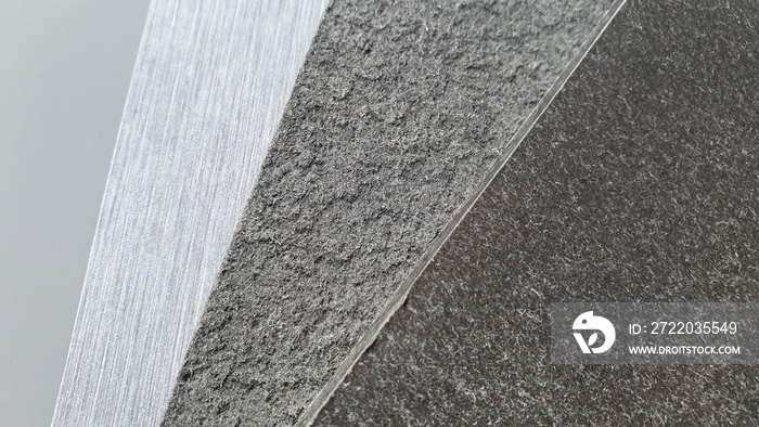 close up fiber cement board samples swatch containing metallic and rough textures in grey tone use f