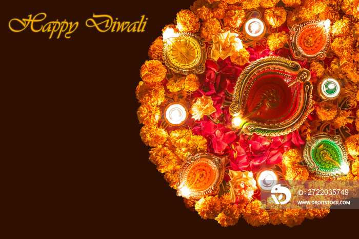 Diwali festival background concept with lighted clay diya oil lamps and lovely floral decorations wi