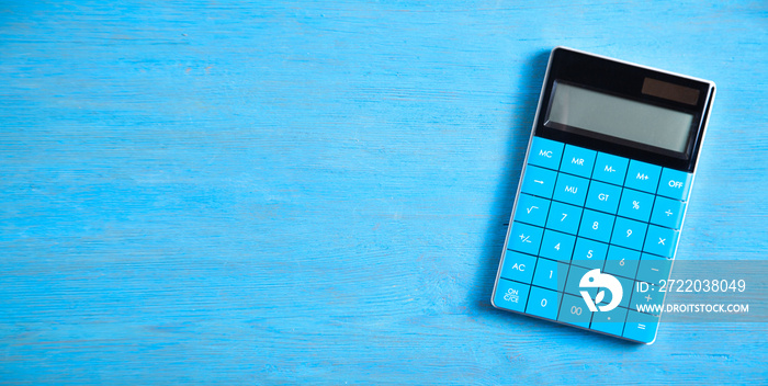 Calculator on the blue background.