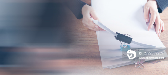 woman checking papers on the desktop