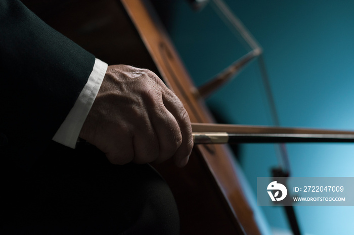 Professional cellist performing hands close up