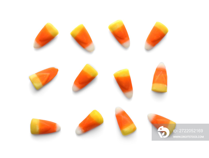 Colorful Halloween candies on white background