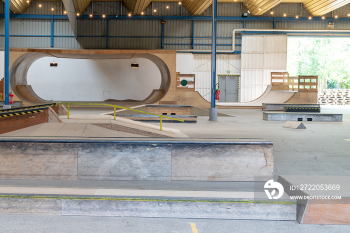 View of basement wooden halfpipe and Box Jumps in skatepark Darwin in Bordeaux France