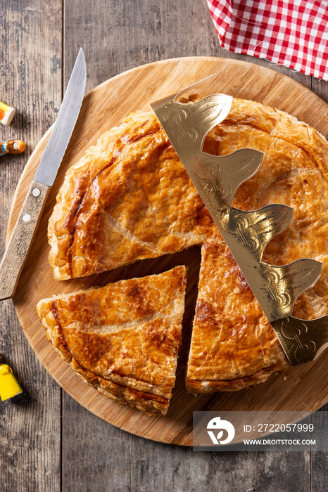 Galette des rois on wooden table. Traditional Epiphany cake in France