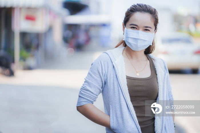 Asian woman wearing a mask.