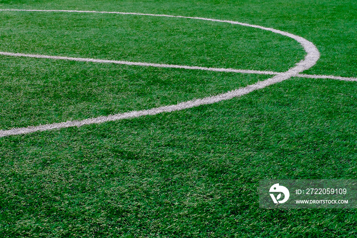 Artificial turf soccer field with center marker line.