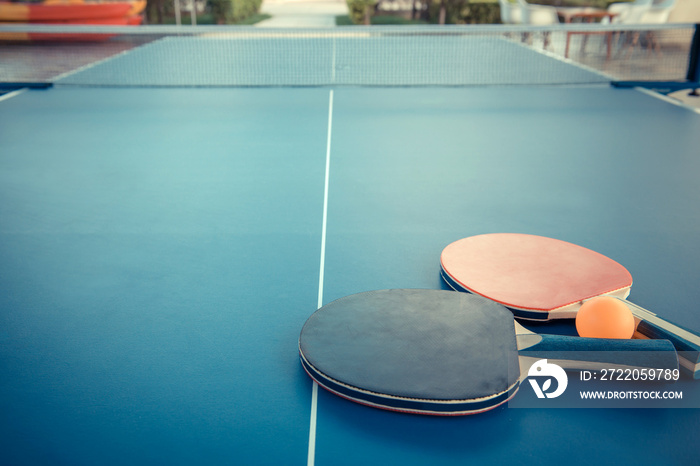 Tabletennis or ping pong rackets and balls on table. Sport concept