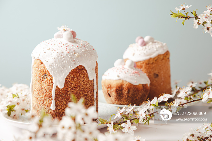 Easter cake with glace icing and decoration. Postcard with Easter bread. Christian traditions. Copy 