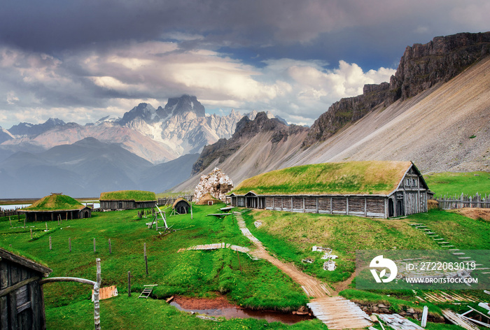 Traditional Viking village. Wooden houses near the mountain firs