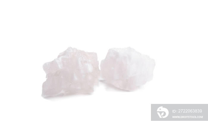 Organic sea white salt tablets on white background.