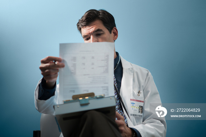 Doctor reading medical documents