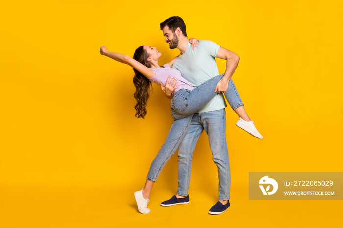 Full length body size view of lovely passionate cheerful couple dancing isolated over bright yellow 