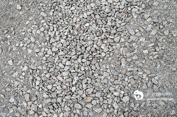 Gravel texture. Fine and large gray granite stone gravel.