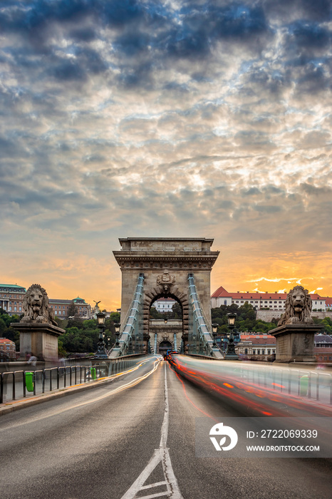 Budapest, Hungary - The iconic Szechenyi Chain Bridge at sunset with amazing sky and heavy afternoon