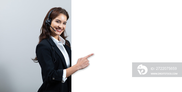 Attractive business woman in suits and headsets are smiling while working isolate on white backgroun