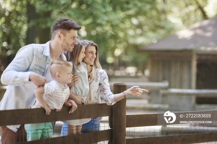 Happy family at the zoo