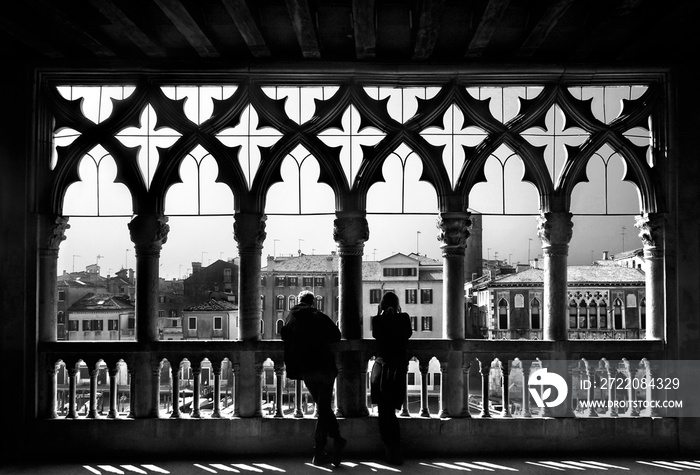 Couple enjoying the view to the Grand Canal of Venice, Italy.