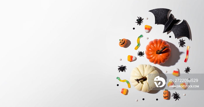 Pumpkins with Halloween decorations - overhead view flat lay