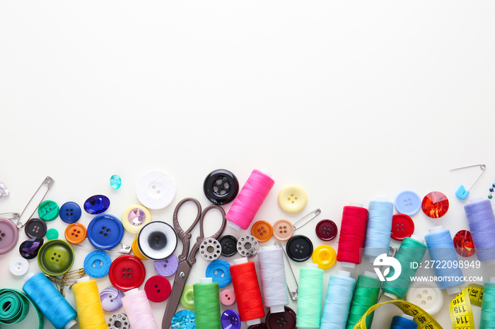 Set of sewing threads and accessories on white background