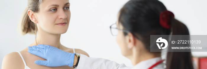 Blonde female on doctors appointment being examined by professional medical worker