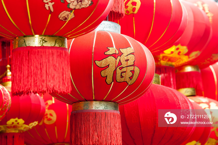 Handmade Fabric red lanterns with Chinese blessing  Fu  on hanging for Chinese new year in a chinatown.