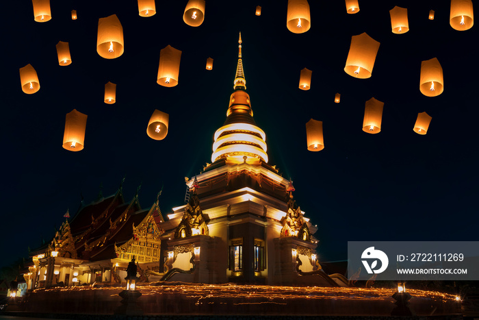 People walk with lighted candles to respect Buddha at thailand