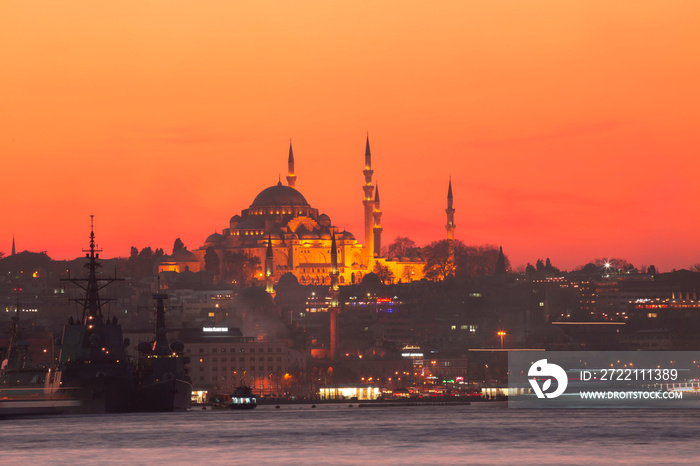 Sunset in Istanbul, Turkey with Suleymaniye Mosque (Ottoman imperial mosque). View from Galata Bridge in Istanbul.