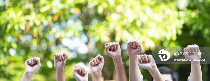 Panoramic group of hands business team raised fist air corporate celebration victory. Victory as a team, fighting for the success of the organization concept.