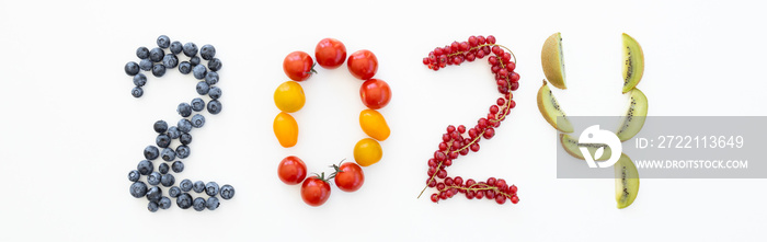 New year 2024 made of fruits on the white background. Healthy food