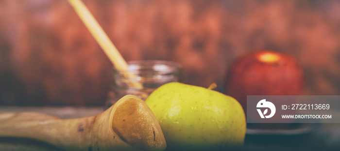 Shofar on a wood background - rosh hashanah Honey, apple and pomegranate traditional holiday symbols