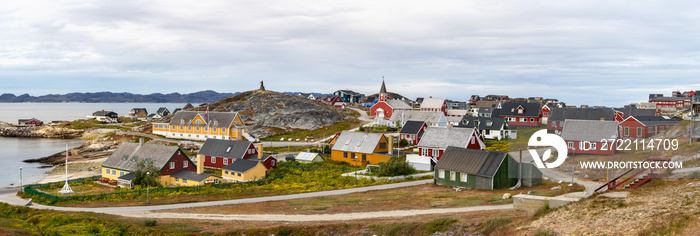 Panoramic view of colorful houses with the school Det gamle Sygehus, the cathedral and the statue of Hans Egede in the background, Nuuk, Greenland.