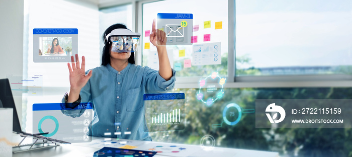 asian woman using augmented reality (ar) and Mixed reality glasses simulation meeting and working with hologram over table at office.virtual reality development process concept