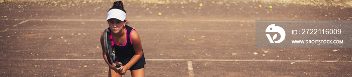 Panoramic banner portrait of teenager girl playing tennis on court.